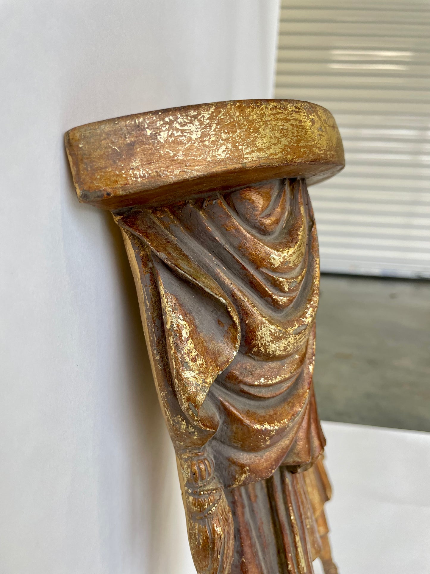 Pair of wood sconce shelves with gold gilding, swags and tassels