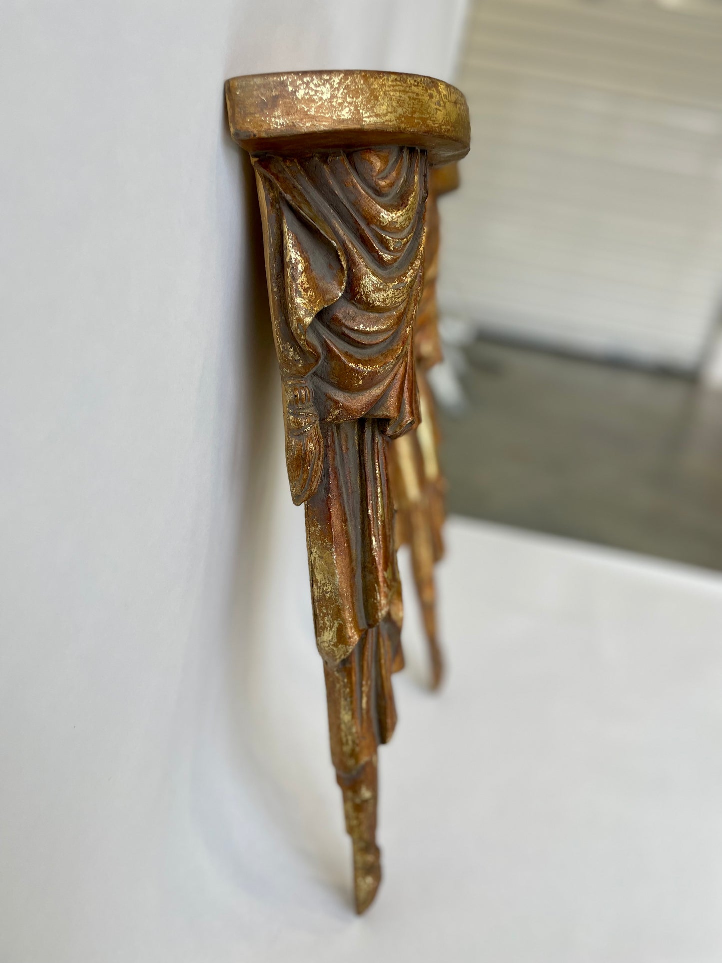 Pair of wood sconce shelves with gold gilding, swags and tassels